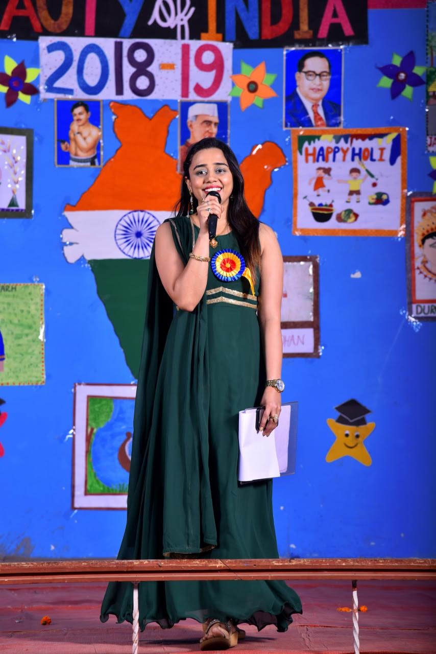 On stage with children during a school cultural programme